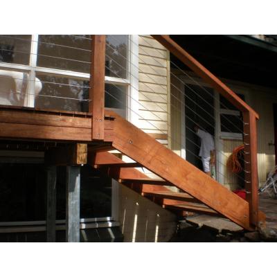 Stairs with Stainless wire hand rail, with solid merbau top rail and posts
