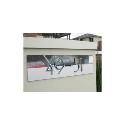 Custom 3D lettering sign with polished and brushed Alumabond faceplate.