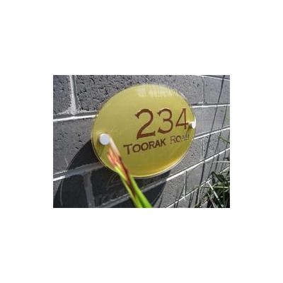 Glass acrylic house sign with vinyl background and letters/numbers.