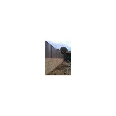 Colorbond fence installed on to a Limestone retaining wall