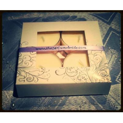 Four scented soy tealight candles.