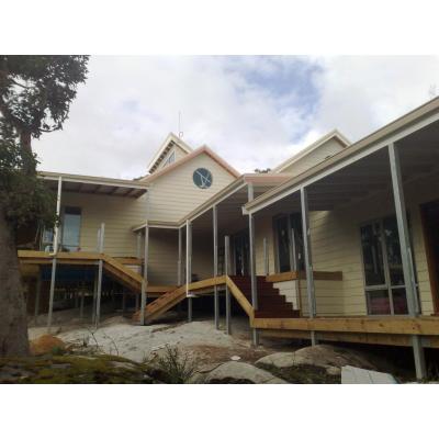 a well designed split level house exceeding 600m2 of floor space, jarrah decking and floor boards.