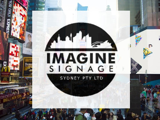 The image features a vibrant view of Times Square, showcasing the hustle and bustle of New York City. Neon signs and billboards dominate the landscape, highlighting the importance of signage in capturing attention. In the foreground, the logo for 'Imagine Signage' is superimposed, emphasising their identity as a key player in the signwriting industry. This context aligns with Imagine Signage's mission to create eye-catching signage that stands out, similar to the famed displays in Times Square. The setting underscores the significance of effective visual communication, showcasing how expertly crafted signs can enhance brand visibility and recognition, which is critical for businesses in locations like Brookvale and its surrounding areas.