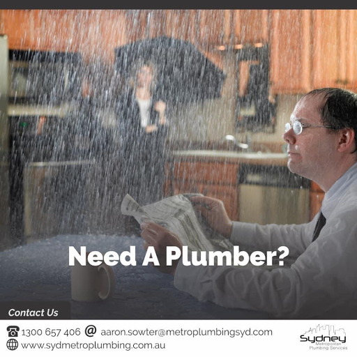 The image portrays a scene of a distressed individual sitting at a kitchen table, reading a newspaper while water pours in from the ceiling, creating a major leak. The person appears to be overwhelmed, perhaps contemplating the urgency of their plumbing problem. In the background, a noticeable umbrella is opened, suggesting an attempt to shield from the cascading water. This highlights a clear need for immediate plumbing assistance. The caption 'Need A Plumber?' emphasises the urgency of plumbing services in such critical situations, which is directly relevant to Penrith City Plumbing Services, a local plumber in Mulgoa. This situation conveys the importance of prompt plumbing solutions, particularly for the residents across various serviced locations where plumbing emergencies can occur.