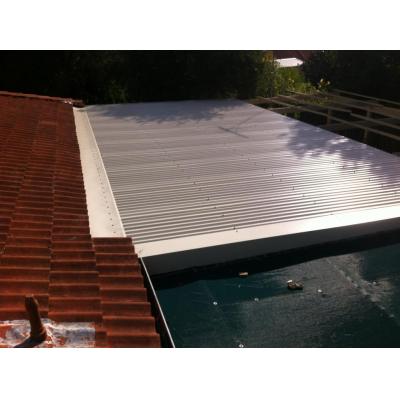 create a pitched roof over existing flat add-on roof to prevent water ingress